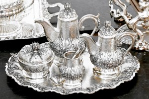 Old luxurious silver tea set at tray